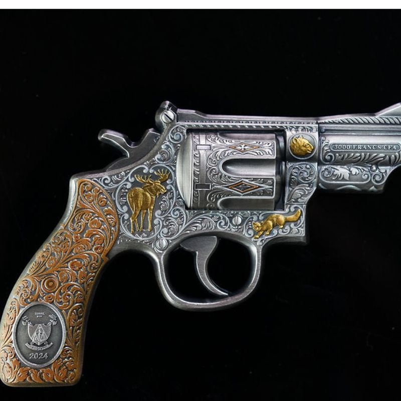 2024 Cameroon 3000 Francs CFA Revolver Gun 5 oz .999 Silver Coin - Featuring a lifelike revolver design with golden wildlife engravings, antique finish.