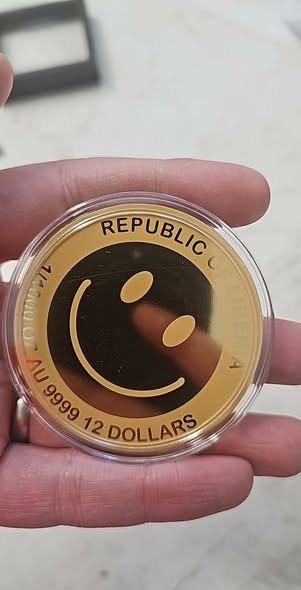 2026 Liberia Smiley 60 mm 1/1000 oz .9999 Gold Coin in Card - Captain’s Chest Bullion