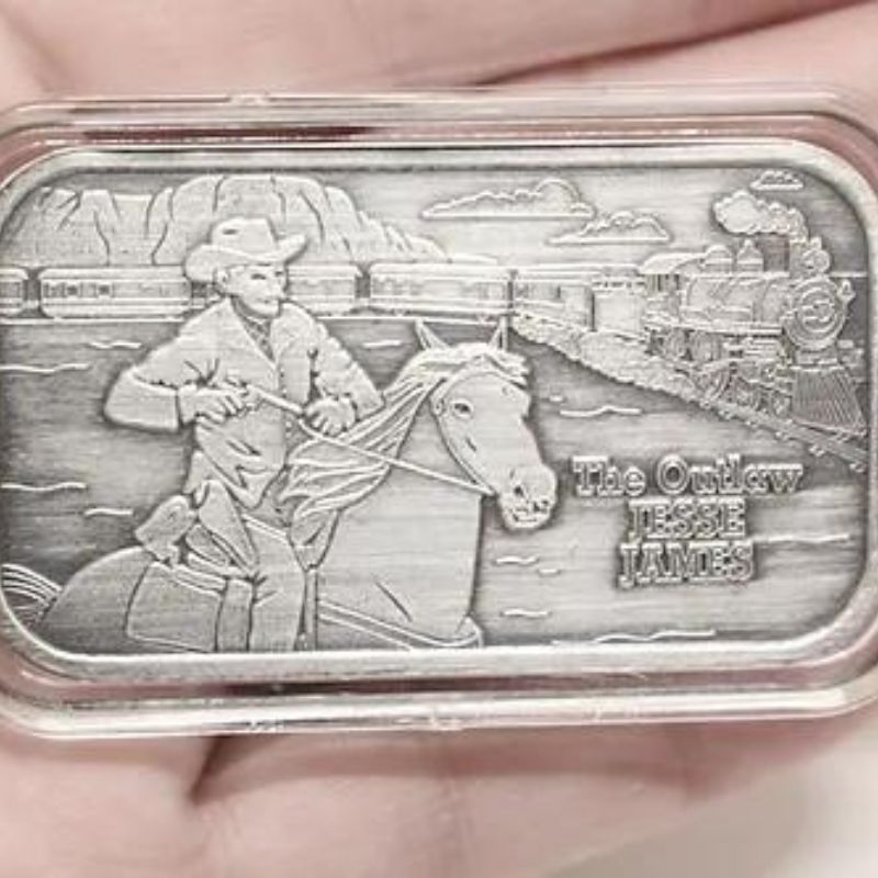 America's Most Wanted Jesse James Silver Round featuring a detailed depiction of Jesse James, crafted from .999 fine silver. A collectible tribute to the infamous Wild West outlaw.