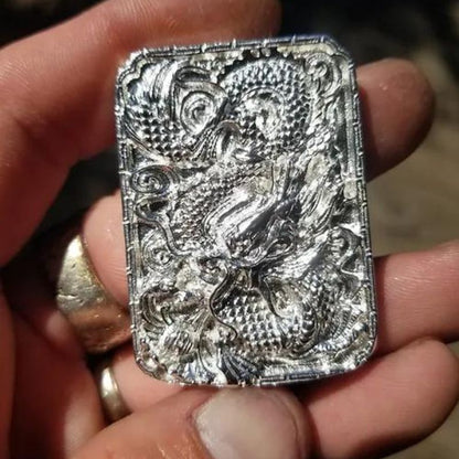 Hand-poured silver bar featuring an intricate Hidden Dragon design, capturing the essence of mystery and ancient wisdom.