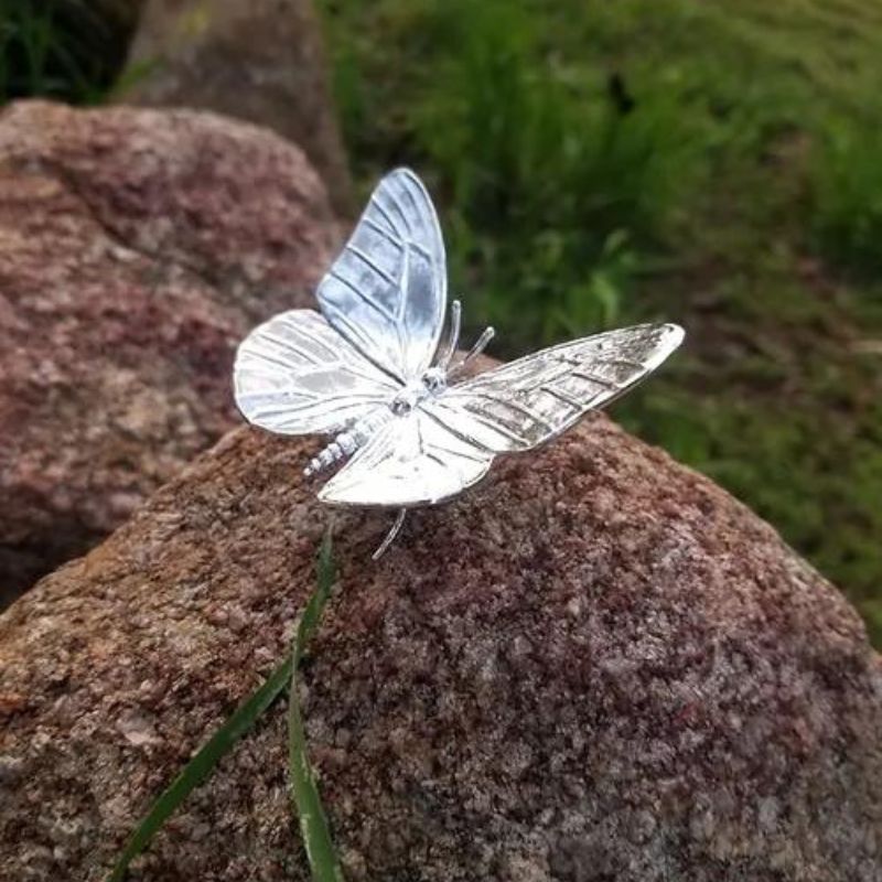 Hand-poured silver bar featuring the intricate design of a Monarch Butterfly, highlighting its delicate wings and patterns.