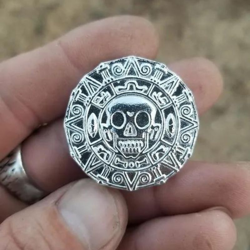 Hand-poured silver coin with intricate pirate-themed design, capturing the mystique of ancient legends and hidden treasures.