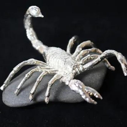 Scorpion Hand-Poured Silver - Detailed, artisan-crafted silver piece featuring a scorpion design.