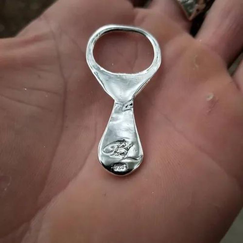 Silver Pop Hand Poured Silver - Unique, artistically designed silver piece with dynamic patterns.