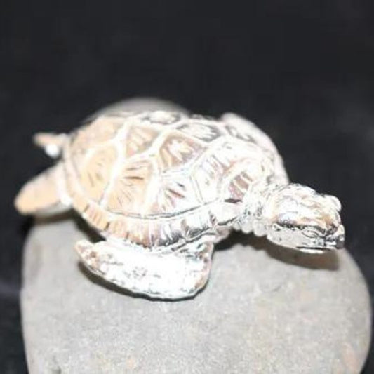 Small Sea Turtle Silver Round crafted from .999 fine silver, featuring an intricate design of a sea turtle. A tranquil and collectible tribute to ocean life.